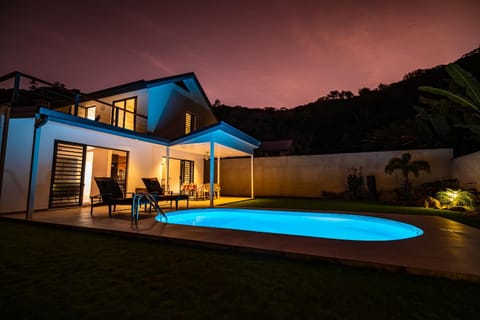 Property building, Patio, Night, Natural landscape, Pool view, Swimming pool, sunbed