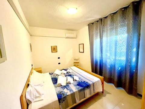 Bed, Bedroom, towels, wardrobe, air conditioner