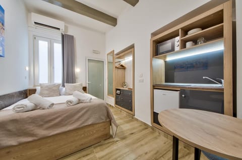 Bed, Photo of the whole room, Bedroom, towels, air conditioner