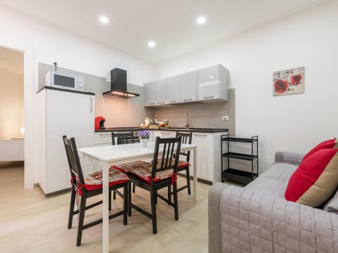 Kitchen or kitchenette, Seating area, Dining area, oven, stove, toaster