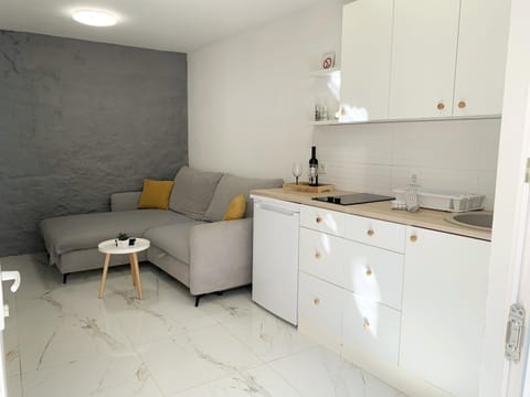 Kitchen or kitchenette, Living room, Seating area, stove