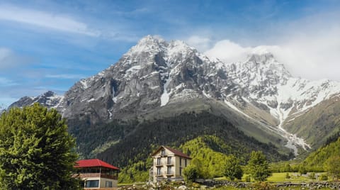 Property building, Nearby landmark, Natural landscape, Mountain view