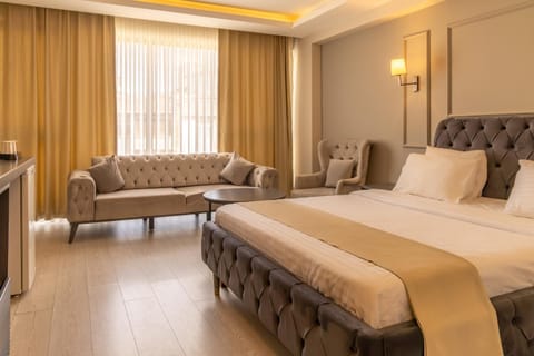Bed, Living room, Seating area, Bedroom