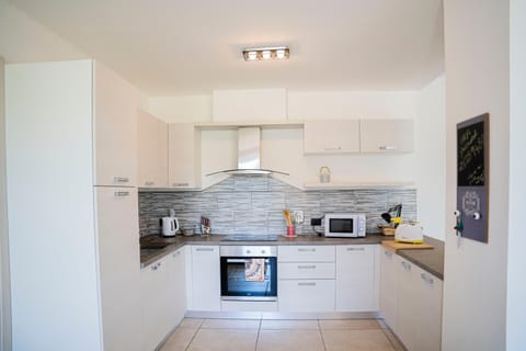 Kitchen or kitchenette, oven, stove, toaster