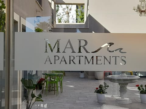 Property building, Patio, Day, Property logo or sign, Logo/Certificate/Sign