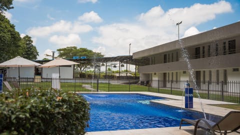 Property building, Patio, Day, Solarium, Pool view, Swimming pool, sunbed