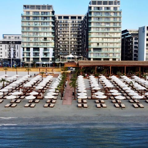 Property building, Restaurant/places to eat, Beach, Swimming pool