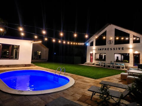 Property building, Night, Pool view, Swimming pool