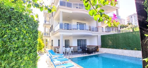 Property building, Patio, Communal lounge/ TV room, Spring, Day, Garden, View (from property/room), Balcony/Terrace, Evening entertainment, Garden view, Pool view, Swimming pool, sunbed