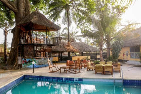 Property building, Patio, Restaurant/places to eat, Natural landscape, Garden, Lounge or bar, Pool view, Swimming pool, sunbed