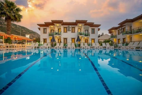 Property building, Natural landscape, Pool view, Swimming pool, sunbed