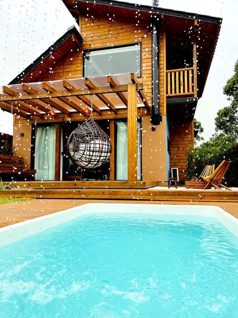 Property building, Day, Property logo or sign, Balcony/Terrace, Logo/Certificate/Sign, Text overlay, Pool view, Swimming pool, Certificate/Award