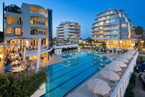 Property building, People, Pool view, Swimming pool, group of guests, sunbed