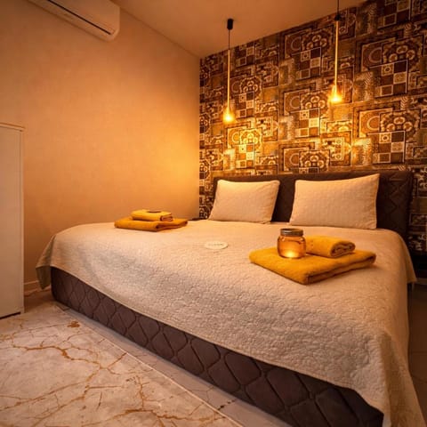 Bed, Photo of the whole room, Bedroom, towels, air conditioner