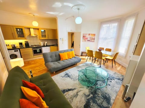 Kitchen or kitchenette, Living room, Seating area, Dining area, dishwasher, oven, stove, toaster, washing machine