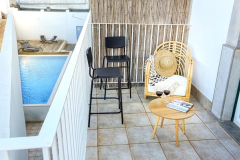 Patio, Living room, Seating area, On site, Pool view, Swimming pool, Time of day, Location, furniture, sunbed