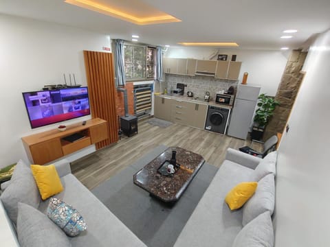 TV and multimedia, Kitchen or kitchenette, Living room, Seating area, Dining area, oven, stove, toaster