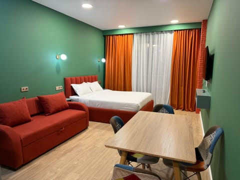 Bed, TV and multimedia, Living room, Photo of the whole room, Seating area, Bedroom, hair dresser