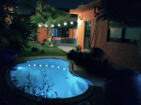 Property building, Patio, Night, Garden, Garden view, Pool view, Swimming pool