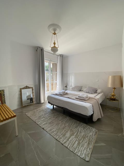 Bed, Photo of the whole room, Bedroom, flat iron, hair dryier, towels
