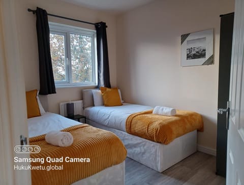 Bed, Photo of the whole room, Bedroom, Text overlay, towels