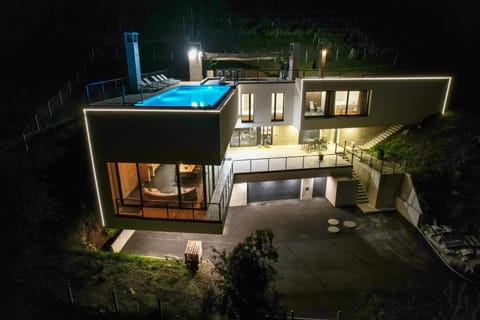 Property building, Patio, Night, Pool view, Swimming pool