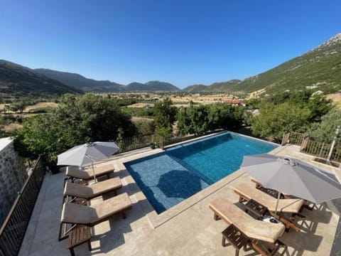 Property building, Patio, Natural landscape, Pool view, Swimming pool, sunbed