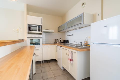 Kitchen or kitchenette, dishwasher, oven, stove, toaster