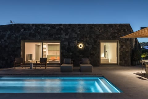 Property building, Patio, Night, Swimming pool, sunbed