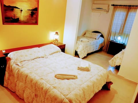 Bed, Photo of the whole room, Bedroom, towels, air conditioner
