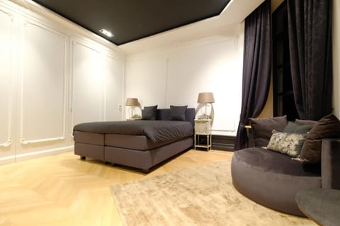 Bed, Seating area, Bedroom