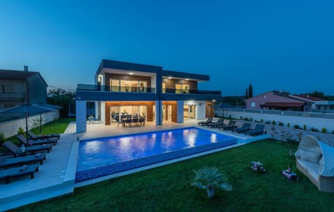 Property building, Patio, Night, Pool view, Swimming pool, sunbed