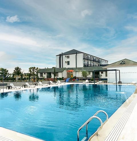 Property building, Day, Natural landscape, Mountain view, Pool view, Swimming pool, Swimming pool, sunbed