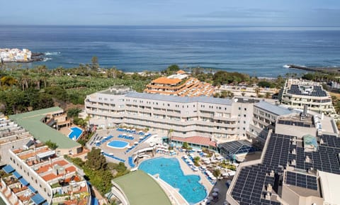 Property building, Nearby landmark, Day, Natural landscape, Beach, City view, Sea view, Swimming pool