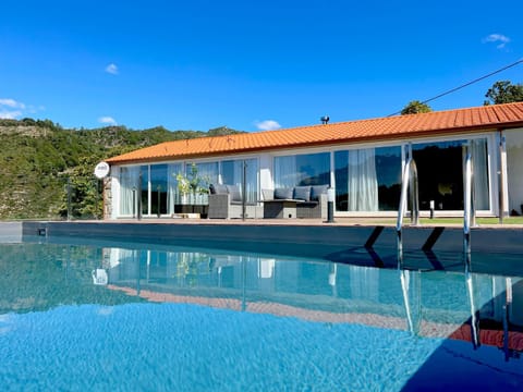 Property building, Natural landscape, Pool view, Swimming pool, sunbed