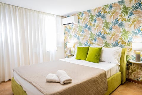 Bed, Photo of the whole room, Bedroom, towels, air conditioner