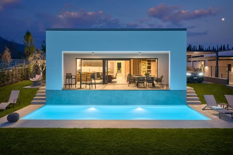 Property building, Patio, Night, Pool view, Swimming pool