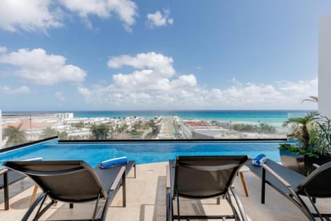 Day, View (from property/room), Seating area, Sea view, Swimming pool