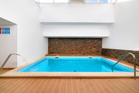 Property building, Living room, Swimming pool