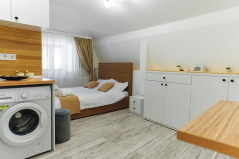 Bed, Kitchen or kitchenette, Bedroom, towels, wardrobe, washing machine, dryer