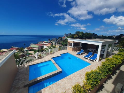 Property building, Day, Natural landscape, Pool view, Sea view, Swimming pool, sunbed