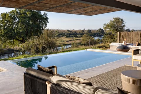 Property building, Patio, Day, Natural landscape, View (from property/room), Balcony/Terrace, Pool view, River view, Swimming pool, sunbed