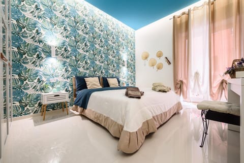 Bed, towels, wardrobe