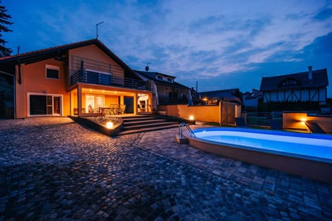 Property building, Patio, Night, Pool view, Swimming pool, sunbed