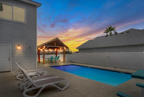 Property building, Patio, Seating area, Swimming pool, Sunset