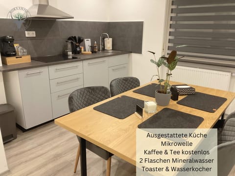 Coffee/tea facilities, Kitchen or kitchenette, Dining area, Text overlay, minibar