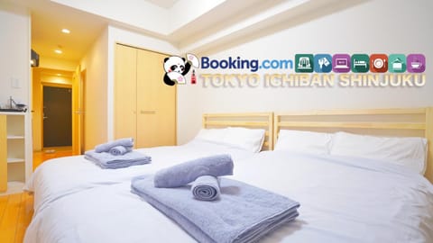 Bed, Property logo or sign, Property logo or sign, Property logo or sign, Photo of the whole room, Logo/Certificate/Sign, Bedroom, Text overlay, Certificate/Award, towels