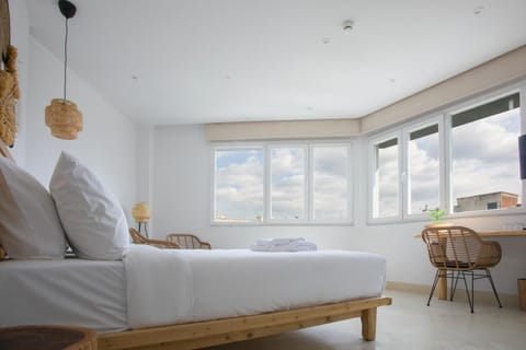 Bed, Day, View (from property/room), Photo of the whole room, Decorative detail, Seating area, Bedroom, City view