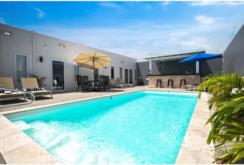 Property building, Pool view, Swimming pool, sunbed