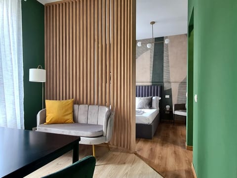 Bed, Living room, Seating area, Bedroom